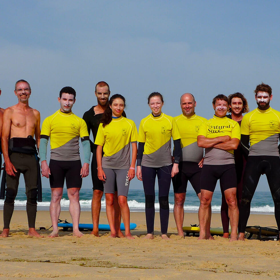 Group taking a surfing lesson on the beach